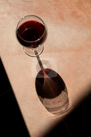 To use this stock image in your creative project, please select the size you need over to the right and click the "Add to Cart" button.
Your downloaded image will come with the Cutcaster watermark removed so don’t worry about the watermark you see on this page. Wine Glass with Dramatic Shadow stock photo, Wine glass with heavy side-light and long by Scott Griessel
