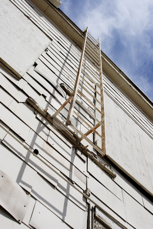 To use this stock image in your creative project, please select the size you need over to the right and click the "Add to Cart" button.
Your downloaded image will come with the Cutcaster watermark removed so don’t worry about the watermark you see on this page. Cloud Stairs on White Hangar stock photo, Emergency ladder from the roof of an abandoned white airport hangar. by Scott Griessel