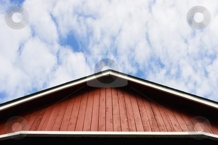 To use this stock image in your creative project, please select the size you need over to the right and click the "Add to Cart" button.
Your downloaded image will come with the Cutcaster watermark removed so don’t worry about the watermark you see on this page. Red Roof and Sky stock photo, Red barn-style roof against a sky with soft clouds. by Scott Griessel