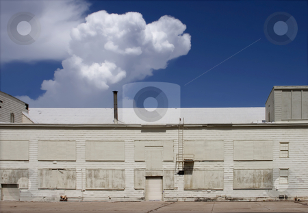 To use this stock image in your creative project, please select the size you need over to the right and click the "Add to Cart" button.
Your downloaded image will come with the Cutcaster watermark removed so don’t worry about the watermark you see on this page. White Hangar and a Storm Brewing stock photo, White airport hangar. by Scott Griessel