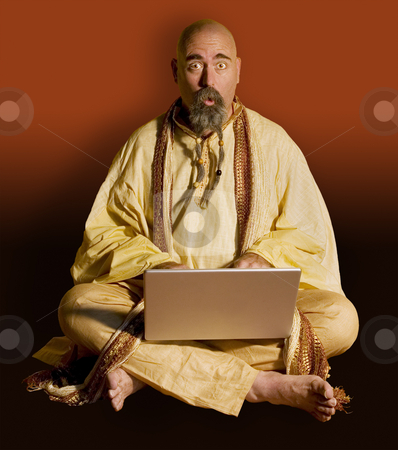 To use this stock image in your creative project, please select the size you need over to the right and click the "Add to Cart" button.
Your downloaded image will come with the Cutcaster watermark removed so don’t worry about the watermark you see on this page. Funny Guru with a LapTop Computer stock photo, Funny Guru Sitting Lotus Style with a LapTop Computer by Scott Griessel