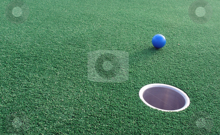 To use this stock image in your creative project, please select the size you need over to the right and click the "Add to Cart" button.
Your downloaded image will come with the Cutcaster watermark removed so don’t worry about the watermark you see on this page. Adventure Golf stock photo, Adventure Golf, ball rolling towards hole. by Lucy Clark