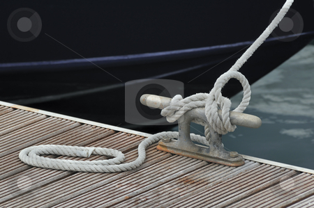 To use this stock image in your creative project, please select the size you need over to the right and click the "Add to Cart" button.
Your downloaded image will come with the Cutcaster watermark removed so don’t worry about the watermark you see on this page. Mooring boat stock photo, Detail of a rope tied up to bitt of a jetty by Massimiliano Leban