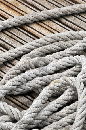To use this stock image in your creative project, please select the size you need over to the right and click the "Add to Cart" button.
Your downloaded image will come with the Cutcaster watermark removed so don’t worry about the watermark you see on this page. Rope stock photo, Close-up of hank of rope on a wooden jetty by Massimiliano Leban