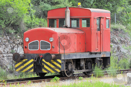 To use this stock image in your creative project, please select the size you need over to the right and click the "Add to Cart" button.
Your downloaded image will come with the Cutcaster watermark removed so don’t worry about the watermark you see on this page. Locomotive stock photo, Red locomotive used to move wagons stopped on railroad by Massimiliano Leban