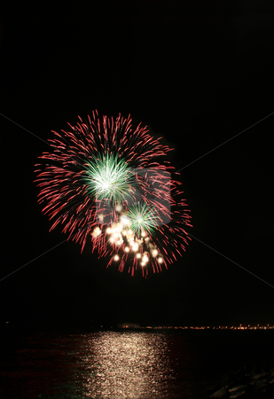 To use this stock image in your creative project, please select the size you need over to the right and click the "Add to Cart" button.
Your downloaded image will come with the Cutcaster watermark removed so don’t worry about the watermark you see on this page. Red and green floral fireworks stock photo, Red and green floral fireworks by the bay by Jonas Marcos San Luis