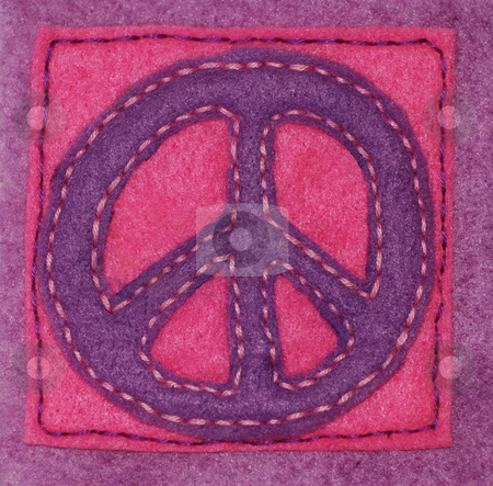 To use this stock image in your creative project, please select the size you need over to the right and click the "Add to Cart" button.
Your downloaded image will come with the Cutcaster watermark removed so don’t worry about the watermark you see on this page. Hand-sewn Peace Sign stock photo, An anti-war symbol hand sewn on felt by Philippa Willitts