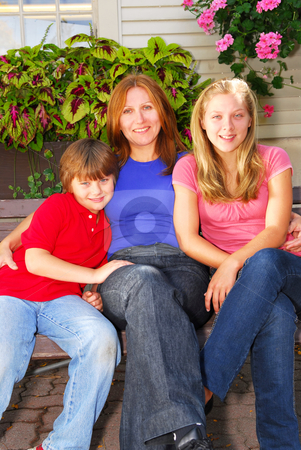 To use this stock image in your creative project, please select the size you need over to the right and click the "Add to Cart" button.
Your downloaded image will come with the Cutcaster watermark removed so don’t worry about the watermark you see on this page. Family at a house stock photo, Portrait of a smiling family - mother and children - in front of the house by Elena Elisseeva