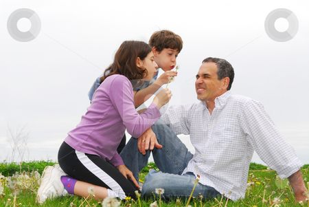 To use this stock image in your creative project, please select the size you need over to the right and click the "Add to Cart" button.
Your downloaded image will come with the Cutcaster watermark removed so don’t worry about the watermark you see on this page. Happy family stock photo, Children playing with their father blowing dandelions by Elena Elisseeva