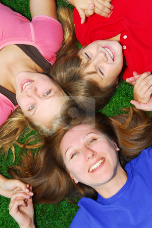 To use this stock image in your creative project, please select the size you need over to the right and click the "Add to Cart" button.
Your downloaded image will come with the Cutcaster watermark removed so don’t worry about the watermark you see on this page. Family lying down on grass stock photo, Portrait of a family - mother and children - lying on grass in a park by Elena Elisseeva