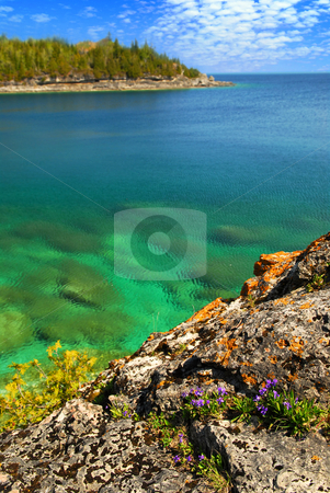 To use this stock image in your creative project, please select the size you need over to the right and click the "Add to Cart" button.
Your downloaded image will come with the Cutcaster watermark removed so don’t worry about the watermark you see on this page. Scenic lake view stock photo, Beautiful view of a scenic lake with clear water. Georgian Bay, Canada by Elena Elisseeva