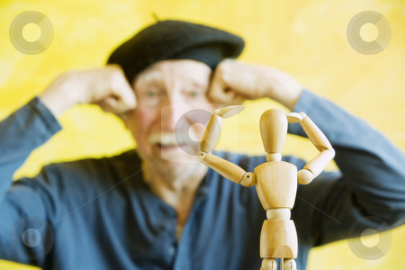 To use this stock image in your creative project, please select the size you need over to the right and click the "Add to Cart" button.
Your downloaded image will come with the Cutcaster watermark removed so don’t worry about the watermark you see on this page. Artist Mimics a Wooden Figure stock photo, Crazy artist pmimics a wooden figure model by Scott Griessel