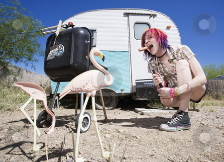 To use this stock image in your creative project, please select the size you need over to the right and click the "Add to Cart" button.
Your downloaded image will come with the Cutcaster watermark removed so don’t worry about the watermark you see on this page. Girl in front of a trailer eating a hotdog stock photo, Girl in front of a trailer with a hotdog and a barbecue by Scott Griessel