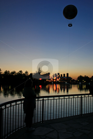 To use this stock image in your creative project, please select the size you need over to the right and click the "Add to Cart" button.
Your downloaded image will come with the Cutcaster watermark removed so don’t worry about the watermark you see on this page. Balloon Sunset stock photo, The Silhouettes of Buildings and a Balloon at Sunset by Lucy Clark