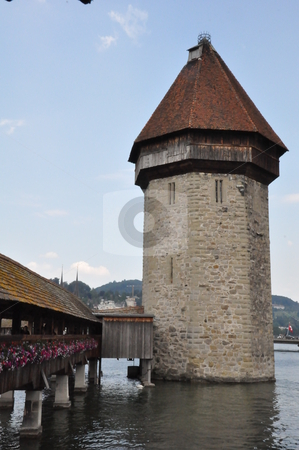 To use this stock image in your creative project, please select the size you need over to the right and click the "Add to Cart" button.
Your downloaded image will come with the Cutcaster watermark removed so don’t worry about the watermark you see on this page. Wooden Bridge in Lucerne stock photo, Wooden Bridge in Lucerne, Switzerland by Ritu Jethani
