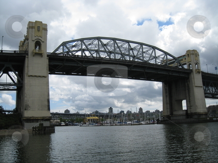 To use this stock image in your creative project, please select the size you need over to the right and click the "Add to Cart" button.
Your downloaded image will come with the Cutcaster watermark removed so don’t worry about the watermark you see on this page. Burrard Bridge in Vancouver stock photo, Burrard Bridge in Vancouver, Canada by Ritu Jethani