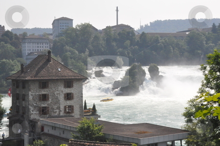 To use this stock image in your creative project, please select the size you need over to the right and click the "Add to Cart" button.
Your downloaded image will come with the Cutcaster watermark removed so don’t worry about the watermark you see on this page. Rhine Falls in Schaffhausen stock photo, Rhine Falls in Schaffhausen at the border of Germany and Switzerland by Ritu Jethani