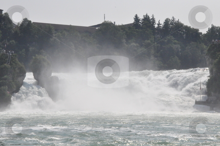 To use this stock image in your creative project, please select the size you need over to the right and click the "Add to Cart" button.
Your downloaded image will come with the Cutcaster watermark removed so don’t worry about the watermark you see on this page. Rhine Falls in Schaffhausen stock photo, Rhine Falls in Schaffhausen at the border of Germany and Switzerland by Ritu Jethani