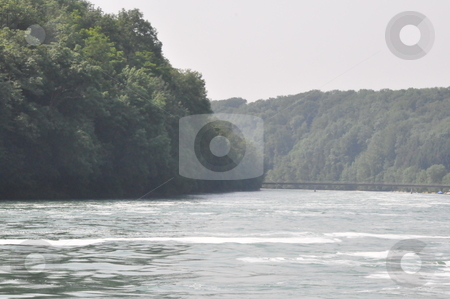 To use this stock image in your creative project, please select the size you need over to the right and click the "Add to Cart" button.
Your downloaded image will come with the Cutcaster watermark removed so don’t worry about the watermark you see on this page. Rhine River in Schaffhausen stock photo, Rhine River in Schaffhausen at the border of Germany and Switzerland by Ritu Jethani