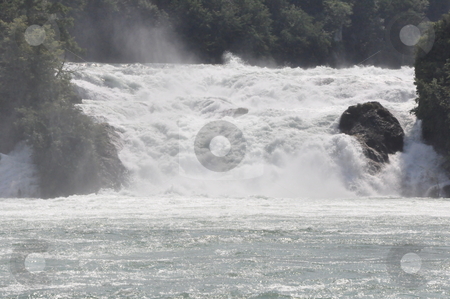 To use this stock image in your creative project, please select the size you need over to the right and click the "Add to Cart" button.
Your downloaded image will come with the Cutcaster watermark removed so don’t worry about the watermark you see on this page. Rhine Falls in Schaffhausen stock photo, Rhine Falls in Schaffhausen at the border of Germany and Switzerland by Ritu Jethani