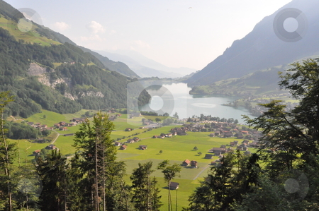 To use this stock image in your creative project, please select the size you need over to the right and click the "Add to Cart" button.
Your downloaded image will come with the Cutcaster watermark removed so don’t worry about the watermark you see on this page. Lake in Switzerland stock photo, Lake in Switzerland, Europe by Ritu Jethani