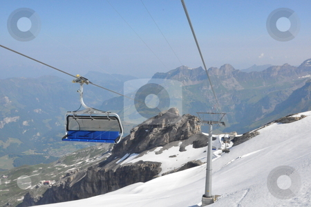 To use this stock image in your creative project, please select the size you need over to the right and click the "Add to Cart" button.
Your downloaded image will come with the Cutcaster watermark removed so don’t worry about the watermark you see on this page. Chairlifts at Mount Titlis stock photo, Chairlifts at Mount Titlis, Switzerland by Ritu Jethani