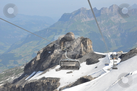 To use this stock image in your creative project, please select the size you need over to the right and click the "Add to Cart" button.
Your downloaded image will come with the Cutcaster watermark removed so don’t worry about the watermark you see on this page. Chairlifts at Mount Titlis stock photo, Chairlifts at Mount Titlis, Switzerland by Ritu Jethani