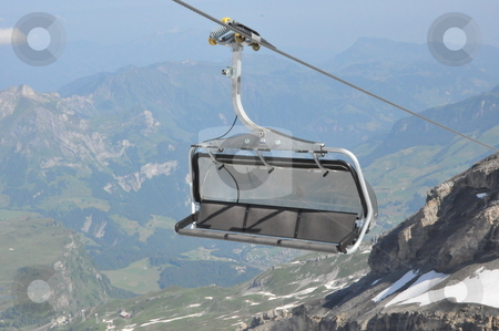 To use this stock image in your creative project, please select the size you need over to the right and click the "Add to Cart" button.
Your downloaded image will come with the Cutcaster watermark removed so don’t worry about the watermark you see on this page. Chairlifts at Mount Titlis stock photo, Chairlifts at Mount Titlis, Switzerland by Ritu Jethani