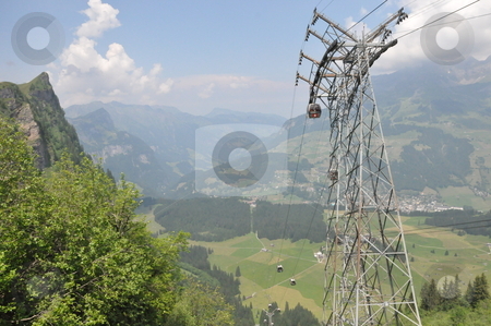 To use this stock image in your creative project, please select the size you need over to the right and click the "Add to Cart" button.
Your downloaded image will come with the Cutcaster watermark removed so don’t worry about the watermark you see on this page. Cable Cars at Mount Titlis stock photo, Cable Cars at Mount Titlis, Switzerland by Ritu Jethani