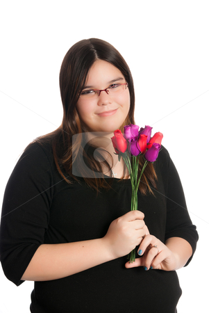 To use this stock image in your creative project, please select the size you need over to the right and click the "Add to Cart" button.
Your downloaded image will come with the Cutcaster watermark removed so don’t worry about the watermark you see on this page. Girl Holding Roses stock photo, A young teen girl is holding a small bouquet of roses, isolated against a white background. by Richard Nelson