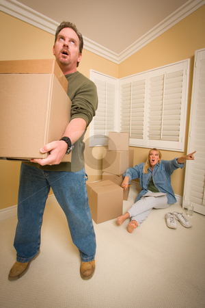 To use this stock image in your creative project, please select the size you need over to the right and click the "Add to Cart" button.
Your downloaded image will come with the Cutcaster watermark removed so don’t worry about the watermark you see on this page. Stressed Man Moving Boxes for Demanding Wife stock photo, Stressed Man Moving Boxes for Demanding Wife Surrounded by Other Boxes. by Andy Dean