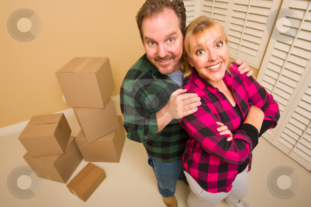 To use this stock image in your creative project, please select the size you need over to the right and click the "Add to Cart" button.
Your downloaded image will come with the Cutcaster watermark removed so don’t worry about the watermark you see on this page. Proud Goofy Couple and Moving Boxes in Empty Room stock photo, Proud Smiling Goofy Couple and Moving Boxes in Empty Room. by Andy Dean