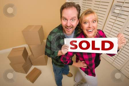 To use this stock image in your creative project, please select the size you need over to the right and click the "Add to Cart" button.
Your downloaded image will come with the Cutcaster watermark removed so don’t worry about the watermark you see on this page. Goofy Couple Holding Sold Sign Surrounded by Boxes stock photo, Goofy Couple Holding Sold Sign in Room Surrounded by Cardboard Boxes. by Andy Dean