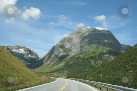 To use this stock image in your creative project, please select the size you need over to the right and click the "Add to Cart" button.
Your downloaded image will come with the Cutcaster watermark removed so don’t worry about the watermark you see on this page. Norwegian Landscape stock photo, norwegian mountains landscape travel road by Stelian Ion