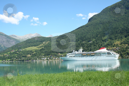 To use this stock image in your creative project, please select the size you need over to the right and click the "Add to Cart" button.
Your downloaded image will come with the Cutcaster watermark removed so don’t worry about the watermark you see on this page. Cruise ship stock photo, Cruise ship in Norway - Europe Travel by Stelian Ion