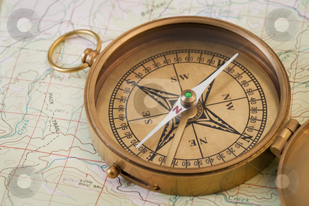 To use this stock image in your creative project, please select the size you need over to the right and click the "Add to Cart" button.
Your downloaded image will come with the Cutcaster watermark removed so don’t worry about the watermark you see on this page. Vintage brass compass stock photo, vintage pocket brass compass opened over topographical map by Marek Uliasz