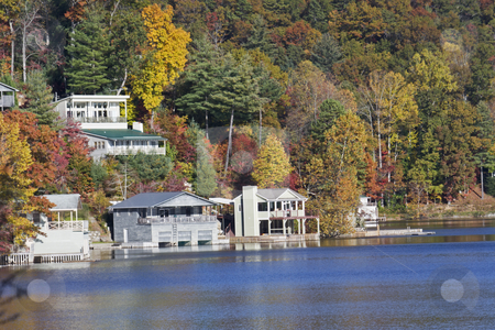 To use this stock image in your creative project, please select the size you need over to the right and click the "Add to Cart" button.
Your downloaded image will come with the Cutcaster watermark removed so don’t worry about the watermark you see on this page. Autumn lakefront homes stock photo, lakefront vacation homes around a North Carolina mountain lake by Lee Barnwell