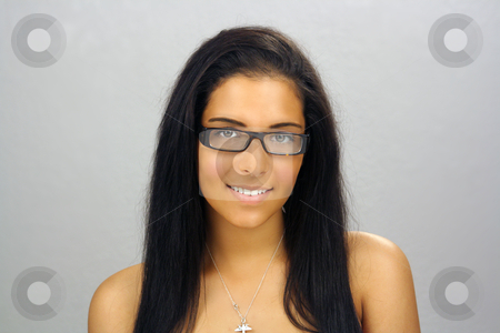 To use this stock image in your creative project, please select the size you need over to the right and click the "Add to Cart" button.
Your downloaded image will come with the Cutcaster watermark removed so don’t worry about the watermark you see on this page. Beautiful Teen Latina Headshot (3) stock photo, Close-up of a lovely teenage Latina with long, luscious black hair and wearing eyeglasses. Moderately retouched. by Carl Stewart