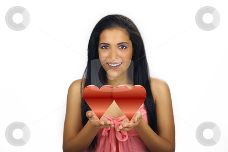 To use this stock image in your creative project, please select the size you need over to the right and click the "Add to Cart" button.
Your downloaded image will come with the Cutcaster watermark removed so don’t worry about the watermark you see on this page. Beautiful Teen Latina Valentine stock photo, A lovely teenage Latina with long, luscious black hair and a bright, warm smile holds two graphic hearts in her cupped hands. by Carl Stewart