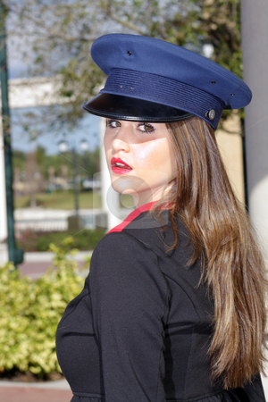 To use this stock image in your creative project, please select the size you need over to the right and click the "Add to Cart" button.
Your downloaded image will come with the Cutcaster watermark removed so don’t worry about the watermark you see on this page. Beautiful Brunette Guard (4) stock photo, Close-up shot of a beautiful young brunette wearing a stylized costume that's remeniscent of the old British Guard, outdoors on a bright, sunny day. by Carl Stewart