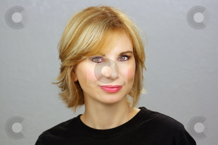 To use this stock image in your creative project, please select the size you need over to the right and click the "Add to Cart" button.
Your downloaded image will come with the Cutcaster watermark removed so don’t worry about the watermark you see on this page. Beautiful Blonde Headshot (1) stock photo, Close-up of a lovely young woman with sandy-blonde hair, plain grey background. by Carl Stewart