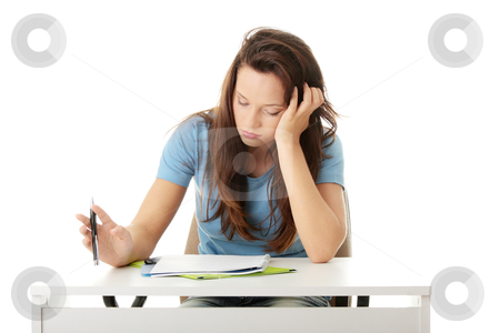 To use this stock image in your creative project, please select the size you need over to the right and click the "Add to Cart" button.
Your downloaded image will come with the Cutcaster watermark removed so don’t worry about the watermark you see on this page. Teenage girl studying at the desk being tired stock photo, Teenage girl studying at the desk being tired, isolated on white
by Piotr_Marcinski