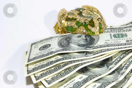 To use this stock image in your creative project, please select the size you need over to the right and click the "Add to Cart" button.
Your downloaded image will come with the Cutcaster watermark removed so don’t worry about the watermark you see on this page. Money in a frog stock photo, money in a frog $ 100 bill isolated on a white background by Shevket