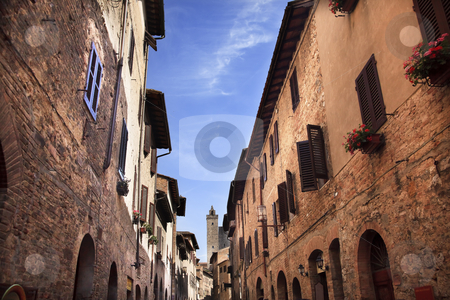 To use this stock image in your creative project, please select the size you need over to the right and click the "Add to Cart" button.
Your downloaded image will come with the Cutcaster watermark removed so don’t worry about the watermark you see on this page. Narrow Street Via San Giovanni San Gimignano Tuscany Italy stock photo, Narrow Street Via San Giovani, Cuganensi Tower San Gimignano Tuscany Italy by William Perry