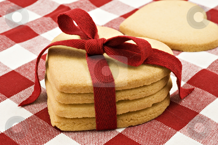 To use this stock image in your creative project, please select the size you need over to the right and click the "Add to Cart" button.
Your downloaded image will come with the Cutcaster watermark removed so don’t worry about the watermark you see on this page. Heart shaped cookies with red ribbon on cloth stock photo, Heart shaped cookies with red ribbon on cloth by tish1