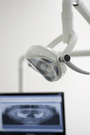 To use this stock image in your creative project, please select the size you need over to the right and click the "Add to Cart" button.
Your downloaded image will come with the Cutcaster watermark removed so don’t worry about the watermark you see on this page. Dentist clinic stock photo, Lightning equipment and a panaromic x-ray from a patient's mouth in a dentist's clinic room by OZMedia