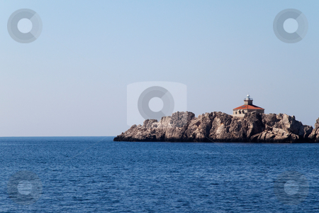 To use this stock image in your creative project, please select the size you need over to the right and click the "Add to Cart" button.
Your downloaded image will come with the Cutcaster watermark removed so don’t worry about the watermark you see on this page. Costal Lighthouse stock photo, A lone lighthouse on a small island by Kevin Tietz