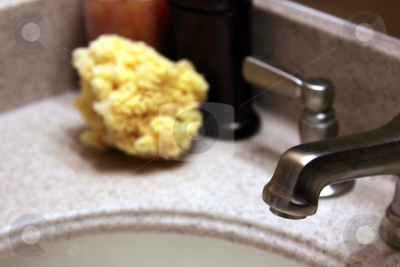 To use this stock image in your creative project, please select the size you need over to the right and click the "Add to Cart" button.
Your downloaded image will come with the Cutcaster watermark removed so don’t worry about the watermark you see on this page. Luxurious Bathroom Tap stock photo, A luxurious bathroom counter top with the tap in focus. by Chris Hill