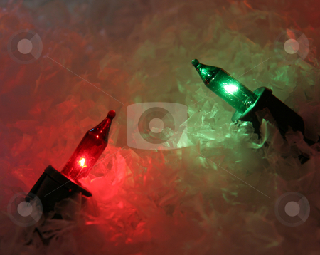 To use this stock image in your creative project, please select the size you need over to the right and click the "Add to Cart" button.
Your downloaded image will come with the Cutcaster watermark removed so don’t worry about the watermark you see on this page. Pair of Xmas Lights stock photo, A red and green Christmas light sitting in fake snow.
by Chris Hill