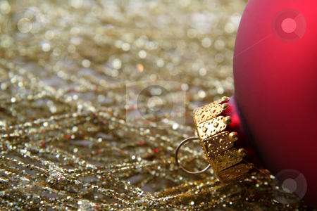 To use this stock image in your creative project, please select the size you need over to the right and click the "Add to Cart" button.
Your downloaded image will come with the Cutcaster watermark removed so don’t worry about the watermark you see on this page. Red Bauble and Gold Wrap stock photo, A red Christmas bauble sitting on gold decorative wrap. by Chris Hill